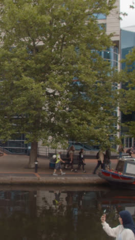 Vertical-Video-Of-Canal-With-Tourists-At-Brindley-Place-In-Birmingham-UK